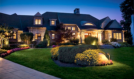 Beautiful home with landscape lighting